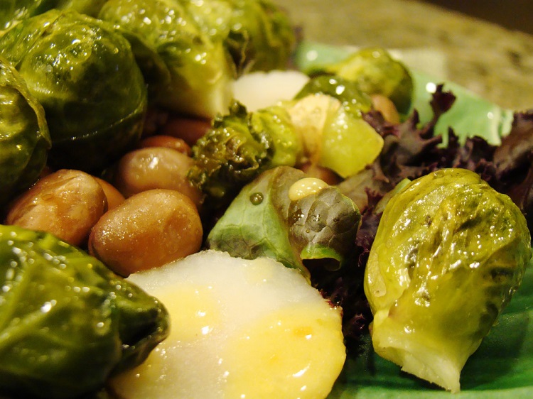 Plate of steamed vegetables including Brussels Sprouts. 