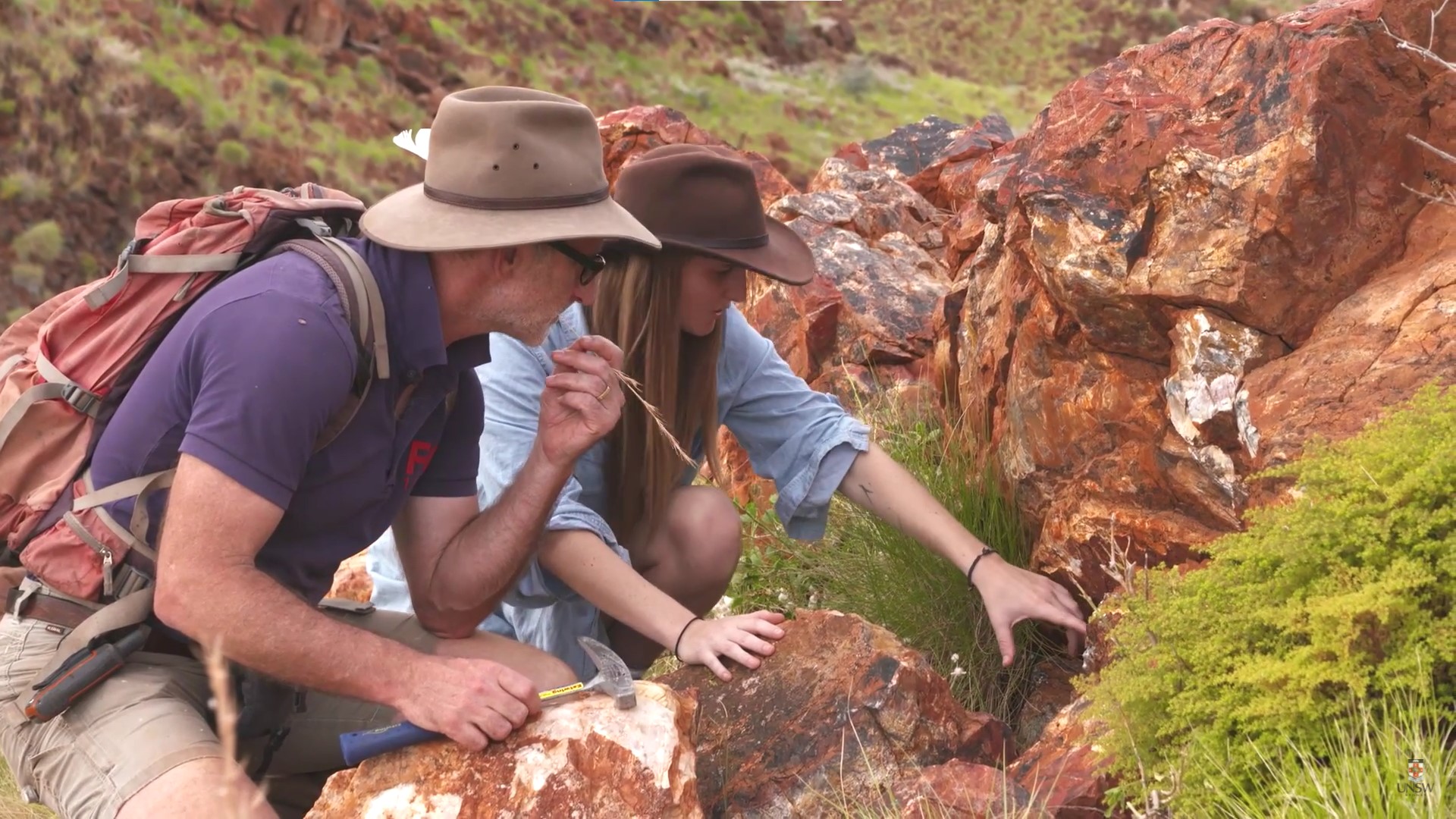 Astrobiologists Martin Van Kranendonk and Tara Djokic examine the fossilized remains of an ancient hot spring in the Pilbara region of Australia. 