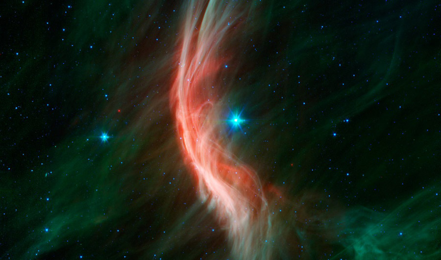 the shock wave, coursing in front of the star Zeta Ophiuchi in the center