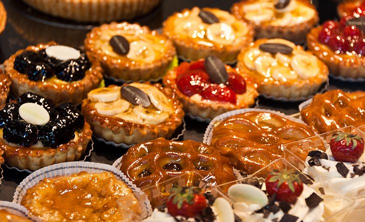 An array of calorie-laden glazed mini-pastries. 