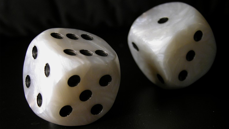 A pair of dice rolling.