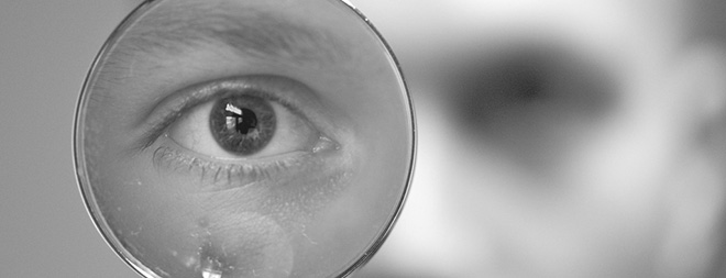 Eye seen through a magnifying glass. 