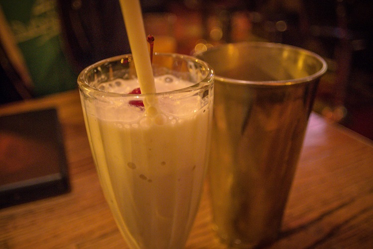 Milkshake with straw and shaker. 