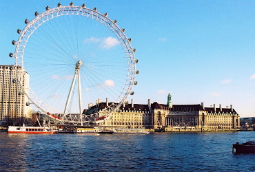 The London Eye Ferris wheel from the river Thames. 
