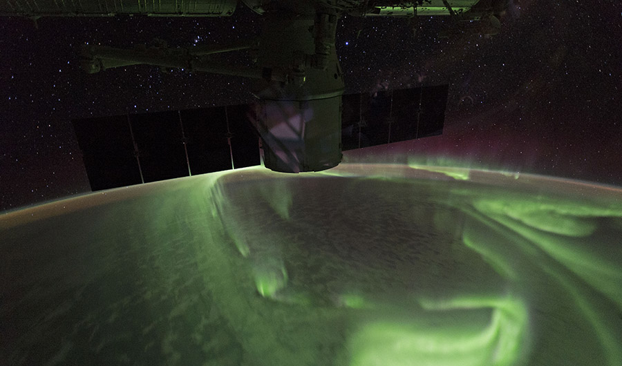 The Southern Lights, as captured by an astronaut on the International Space Station, spread an ethereal green hue across our atmosphere.