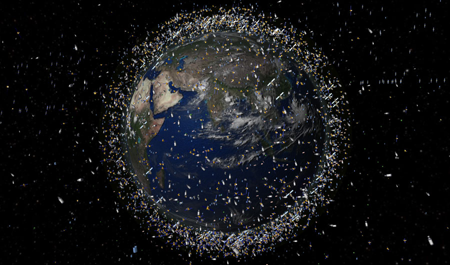 An artist’s depiction of objects currently in low-Earth orbit, shown at an exaggerated scale to make them visible at the scale shown.