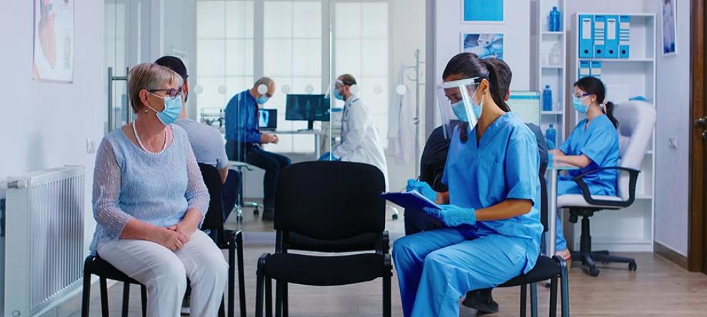 Medical office setting, with staff and patients in masks